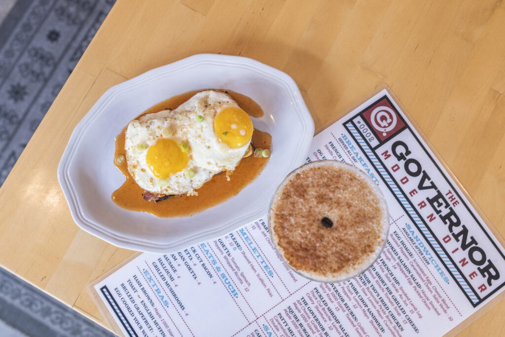 egg breakfast sandwich and coffee and menu